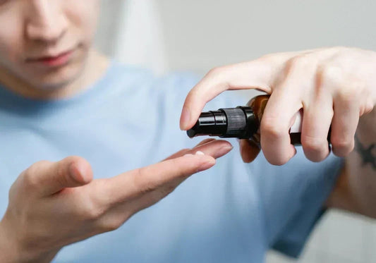 Men using eye serum product