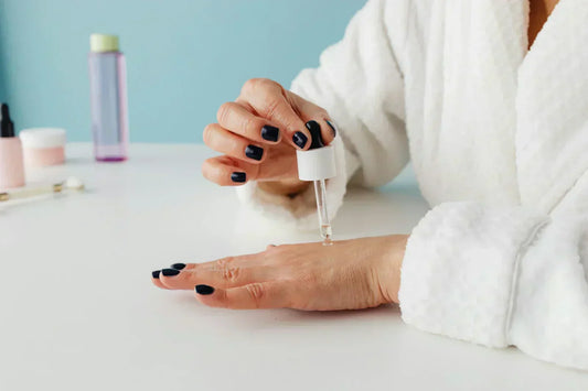 women applying serum