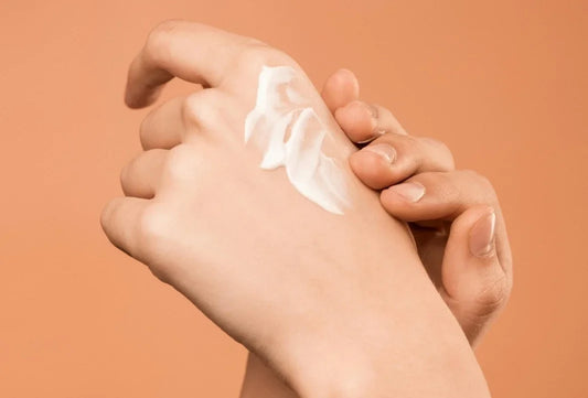 Person using Korean Sunscreen on hand
