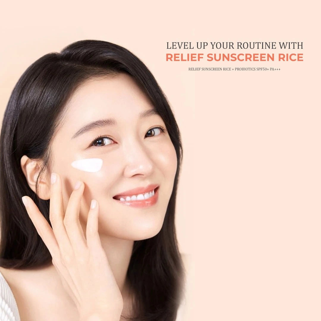 Model applying Beauty of Renforcer Relief Sunscreen Rice + Probiotics SPF50+ – brightening daily sunscreen for soft, radiant skin.